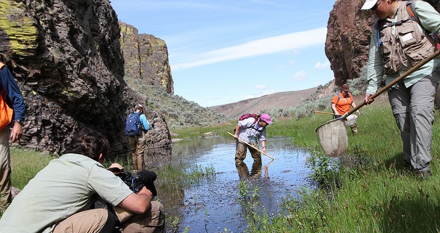 A group conducts research in a water area on public lands. BLM photo.