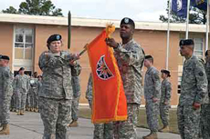NETCOM/9th SC (A) Commanding General Maj. Gen. Susan Lawrence and Command Sgt. Maj. Donald Manley unfurl the new colors of the 7th Signal Command (Theater) during an activation ceremony March 6, 2009, at Fort Gordon, Ga.