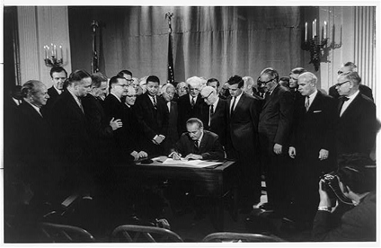 LBJ signs civil rights act