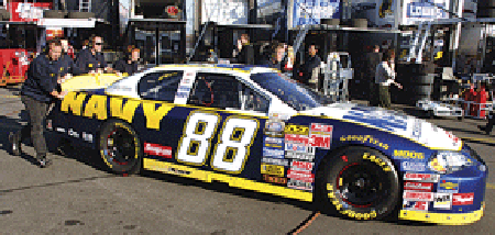 Daytona, Fla. (Feb. 15, 2006) - Members of JR Motorsports push the No. 88 Navy “Accelerate Your Life” Chevrolet Monte Carlo to pit row before practice at the Daytona International Speedway. U.S. Navy photo by Chief Photographer’s Mate Chris Desmond.