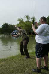 Mentoree at the Steve Harvey Mentoring Weekend catches a fish