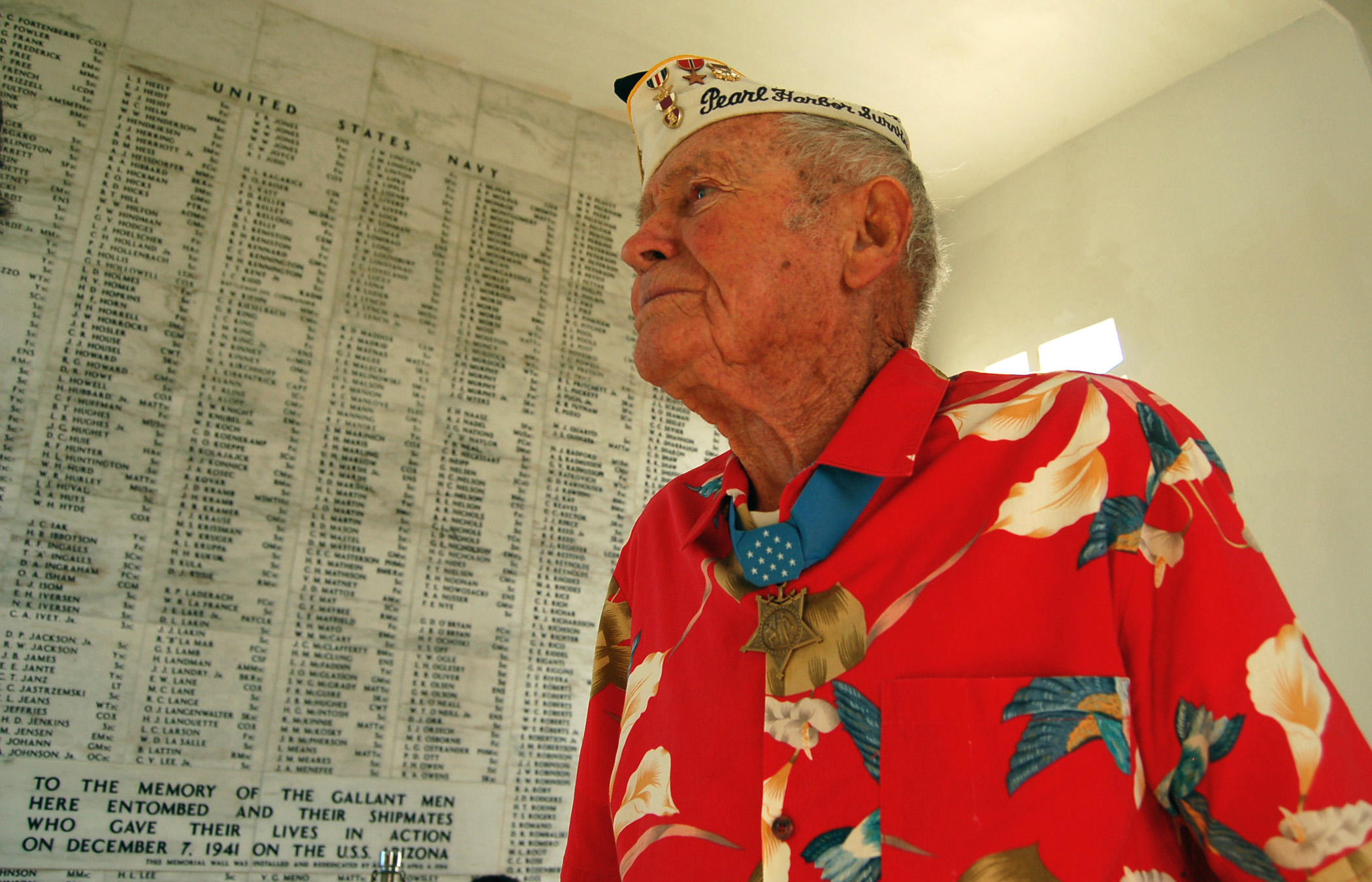 Medal of Honor recipient Lt. John Finn (Ret.) pays his respects to the Sailors and Marines killed aboard USS Arizona during the Dec. 7, 1941 attack on Pearl Harbor. Finn received the Medal of Honor in recognition of heroism and distinguished service during the Japanese attack. As of October 2007, at age 98, Finn is the oldest living Medal of Honor recipient and is also the only living Pearl Harbor Medal of Honor recipient. A chief petty officer at the time, Finn was stationed at Naval Air Station Kaneohe Bay. During the first attack by the Japanese aircraft, Finn took control of a .50 caliber machine gun post and continued to fire on the attacking planes despite getting hit numerous times by enemy strafing fire. U.S. Navy photo by Chief Mass Communication Specialist David Rush.