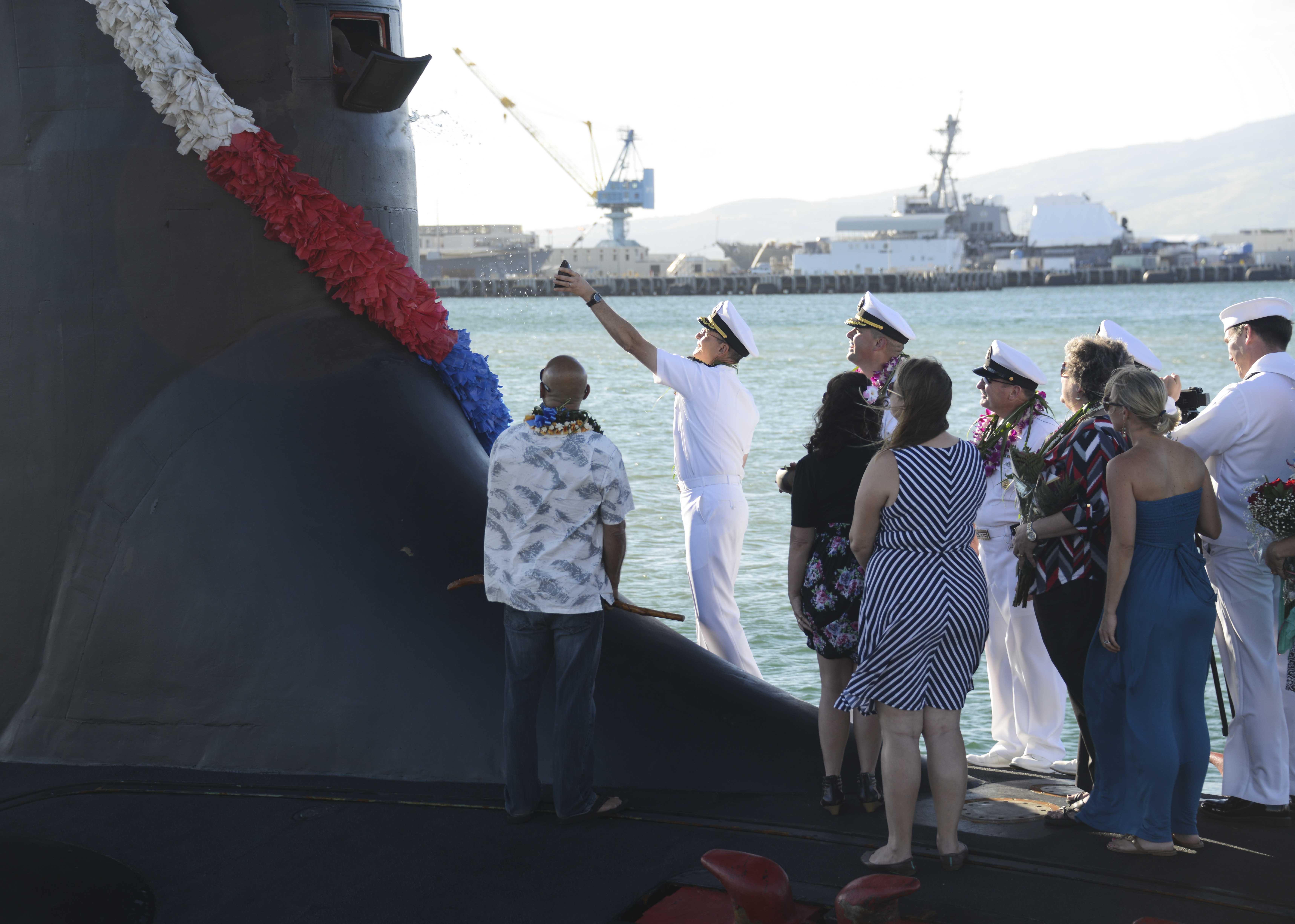 PEARL HARBOR (Nov. 25, 2014) Capt. Harry Ganteaume, commodore of Submarine Squadron (SUBRON) 1, participates in a traditional Hawaiian blessing ceremony of the Virginia-class attack submarine USS Mississippi (SSN 782) upon the ship's arrival at Joint Base Pearl Harbor-Hickam. U.S. Navy photo by Mass Communication Specialist 1st Class Steven Khor.