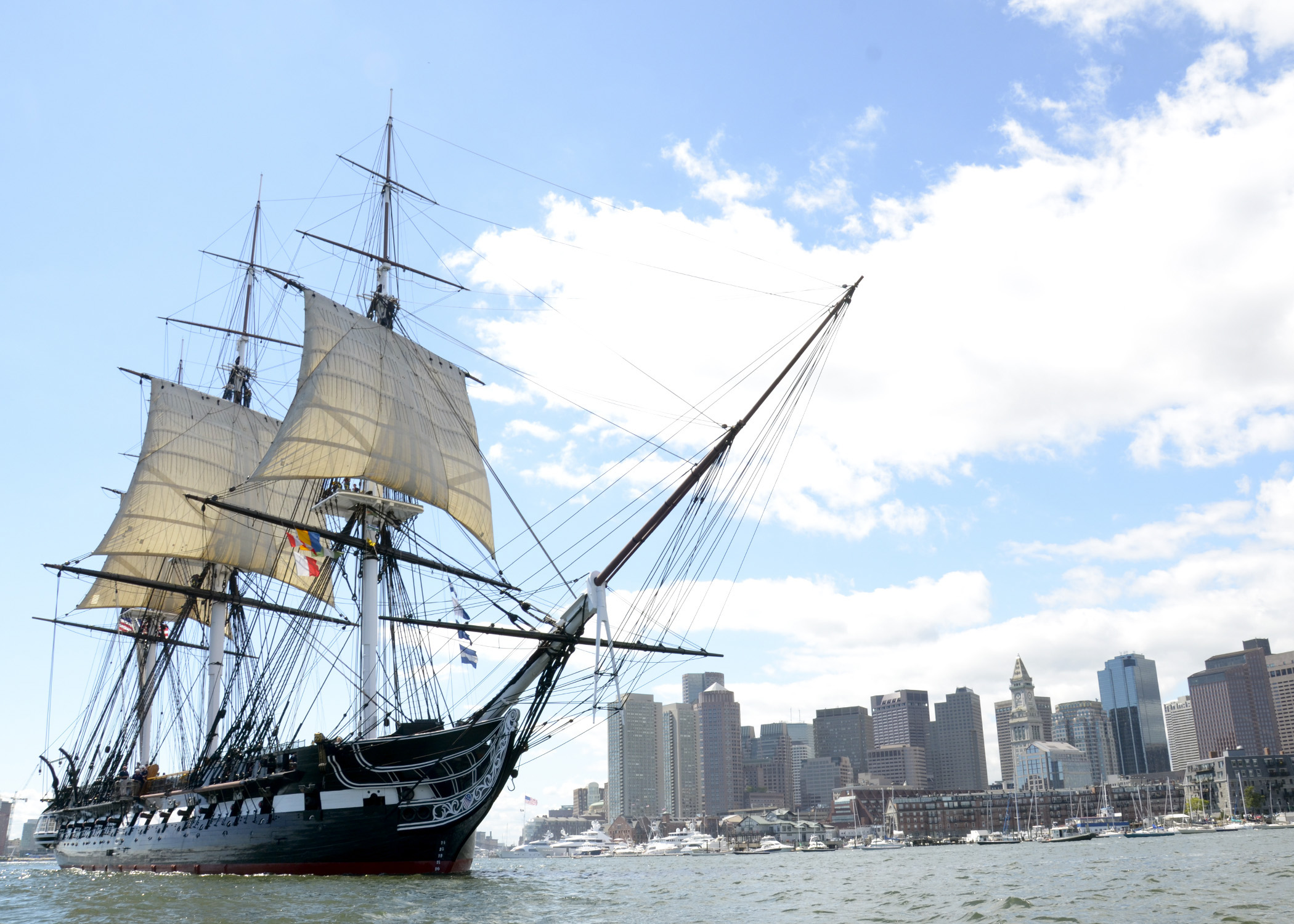 BOSTON (Aug. 29, 2014) USS Constitution sets sail in Boston Harbor during the ship's second and final chief petty officer heritage week underway demonstration of 2014. More than 150 chief petty officer selects and mentors assisted the crew of Constitution with setting the ship's three topsails during the underway to conclude a week of sail training aboard Old Ironsides. U.S. Navy photo by Mass Communication Specialist 3rd Class Victoria Kinney.