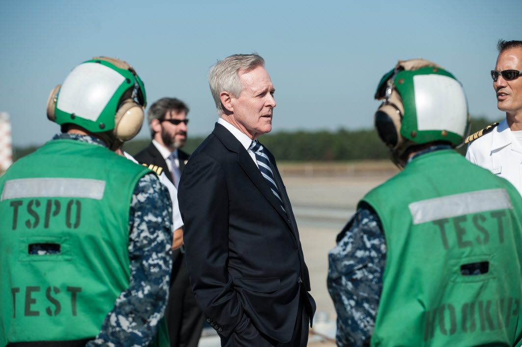 Navy Secretary Ray Mabus talks to sailors preparing to conduct a 51,000 pound dead load launch at the NAVAIR Lakehurst, N.J. electromagnetic test launch track to simulate the equivalent launch of an F/A-18E from a carrier deck during a visit to Joint Base McGuire-Dix-Lakehurst on Sept. 26th.