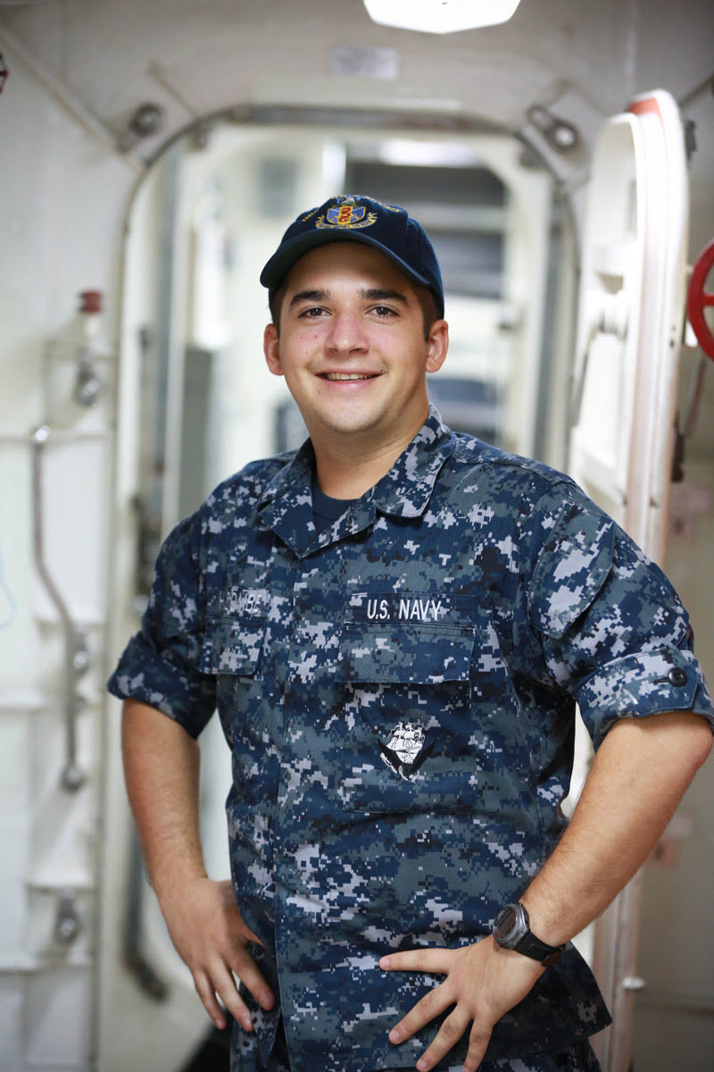 Seaman James Holcombe is an information systems technician aboard USS McCain operating out of Japan. U.S. Navy photo.