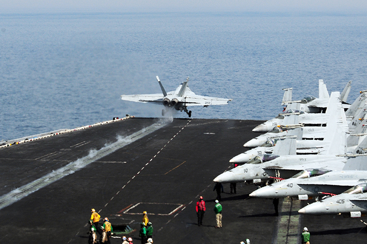 USS GEORGE H.W. BUSH, AT SEA (June 30, 2014) An F/A-18F Super Hornet, attached to the "Fighting Black Lions" of Strike Fighter Squadron (VFA) 213, launches from the flight deck of the aircraft carrier USS George H.W. Bush (CVN 77). George H.W. Bush is supporting maritime security operations and theater security cooperation efforts in the U.S. 5th Fleet area of responsibility. U.S. Navy photo by Mass Communication Specialist 3rd Class Joshua Card. 
