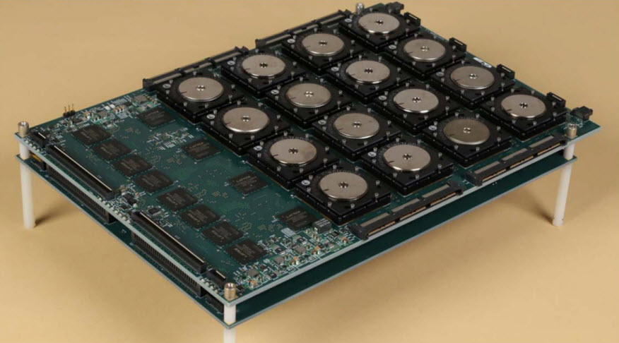 A circuit board shows 16 of the new brain-inspired chips in a 4 X 4 array along with interface hardware. The board is being used to rapidly analyze high-resolutions images. Courtesy of IBM. 
