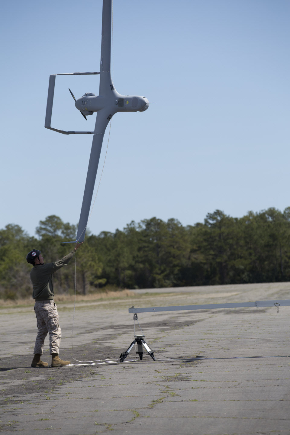 U.S. Marine Corps Lance Cpl. Kirk N. Humes, a maintainer with Marine Unmanned Aerial Vehicle Squadron (VMU) 2, catches a RQ-21A Blackjack at Atlantic Field, N.C., April 1. VMU-2 conducted an early capability flight to train Marines with the new system before deploying in late April. U.S. Marine Corps photo. 