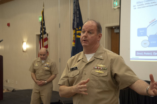 Commander, Naval Network Warfare Command Capt. Gene Costello (foreground) and Commanding Officer, Navy Cyber Defense Operations Command Capt. Douglas Powers deliver remarks at an AFCEA Hampton Roads event April 8, 2014. U.S. Navy photo by MC1(IDW/SW/AW) Elizabeth L. Burke/NETWARCOM Public Affairs.
