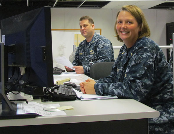 Chief Warrant Officer 3 Terrill Stafford and Ensign Adria Hicks on watch in the NCTAMS LANT Joint Fleet Telecommunications Operations Center, the central point of contact for communications within the Atlantic, Mediterranean and Indian Ocean regions. NCTAMS LANT provides classified and unclassified messaging, voice, data and video to Navy, joint and coalition units.