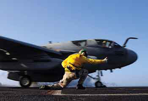 GULF OF OMAN (March 4, 2009) A shooter launches an EA-6B Prowler assigned to the “Shadowhawks” of Electronic Attack Squadron (VAQ) 141 from the aircraft carrier USS Theodore Roosevelt (CVN 71) during routine flight operations. Theodore Roosevelt and Carrier Air Wing 8 are operating in the U.S. 5th Fleet area of responsibility. U.S. Navy Photo by Mass Communication Specialist 3rd Class Jonathan Snyder.