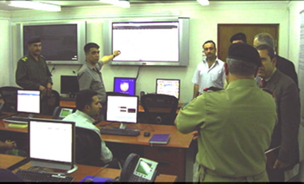 Iraqi students and instructors discuss the capabilities of the Iraqi Defense Network (IDN) to convey the need for continued program support during a visit by senior military leadership Sept. 22, 2008.