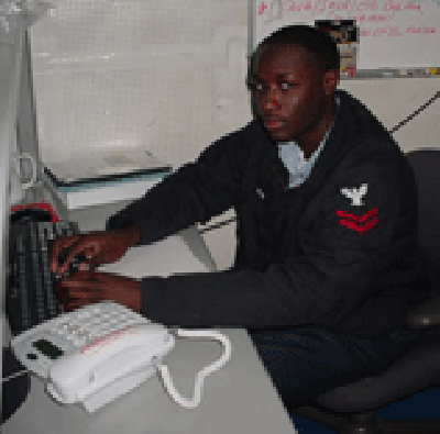 IT2 Sherod Cooper of Carrier Strike Group Twelve participating in a combined fleet, joint and coalition test for an open standards chat capability conducted over the NIPRNET Oct. 19, 2005.