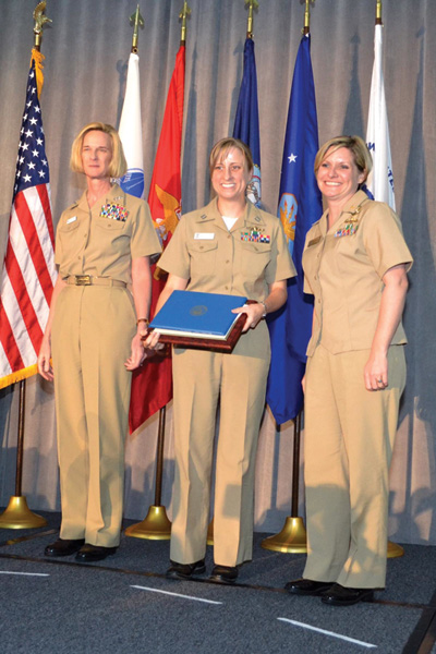 Lt. Sarah Rice received the Junior Officer Capt. Joy Bright Hancock Leadership award presented by (from left) Vice Adm. Carol Pottenger and Lt. Cmdr. Nicole Shue at the Joint Women's Leadership Symposium. The awards are presented annually to recognize inspirational leadership of Navy service members on active or reserved duty. Photo by Chief Petty Officer Lesley Maceyak.