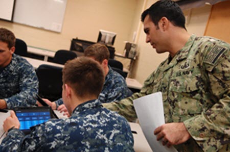 EGLIN AFB, Florida (Dec 16, 2016) A NAVSCOLEOD Instructor demonstrates a Study Application on a student’s tablet. NAVSCOLEOD, located on Eglin Air Force Base, Fla. provides high-risk, specialized, basic and advanced EOD training to U.S. and 97 partner nation military and selected U.S. government personnel each year. U.S. Navy photo by Billy P. Martin/Released