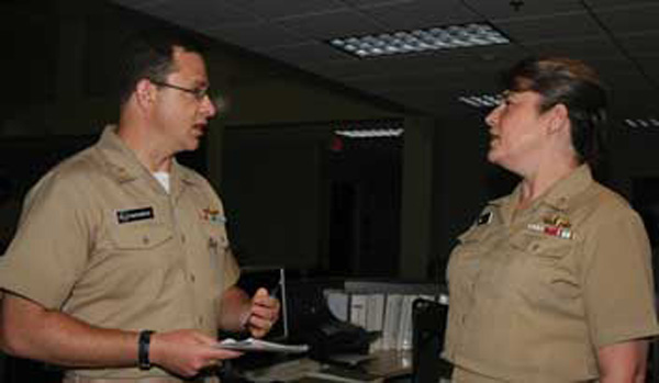 Rear Adm. Janice Hamby in the Maritime Operations Center with battlewatch captain Lt. Cmdr. Jason Babcock July 10, 2007. The battlewatch monitors all aspects of network operations, network defense, space, and information operations.