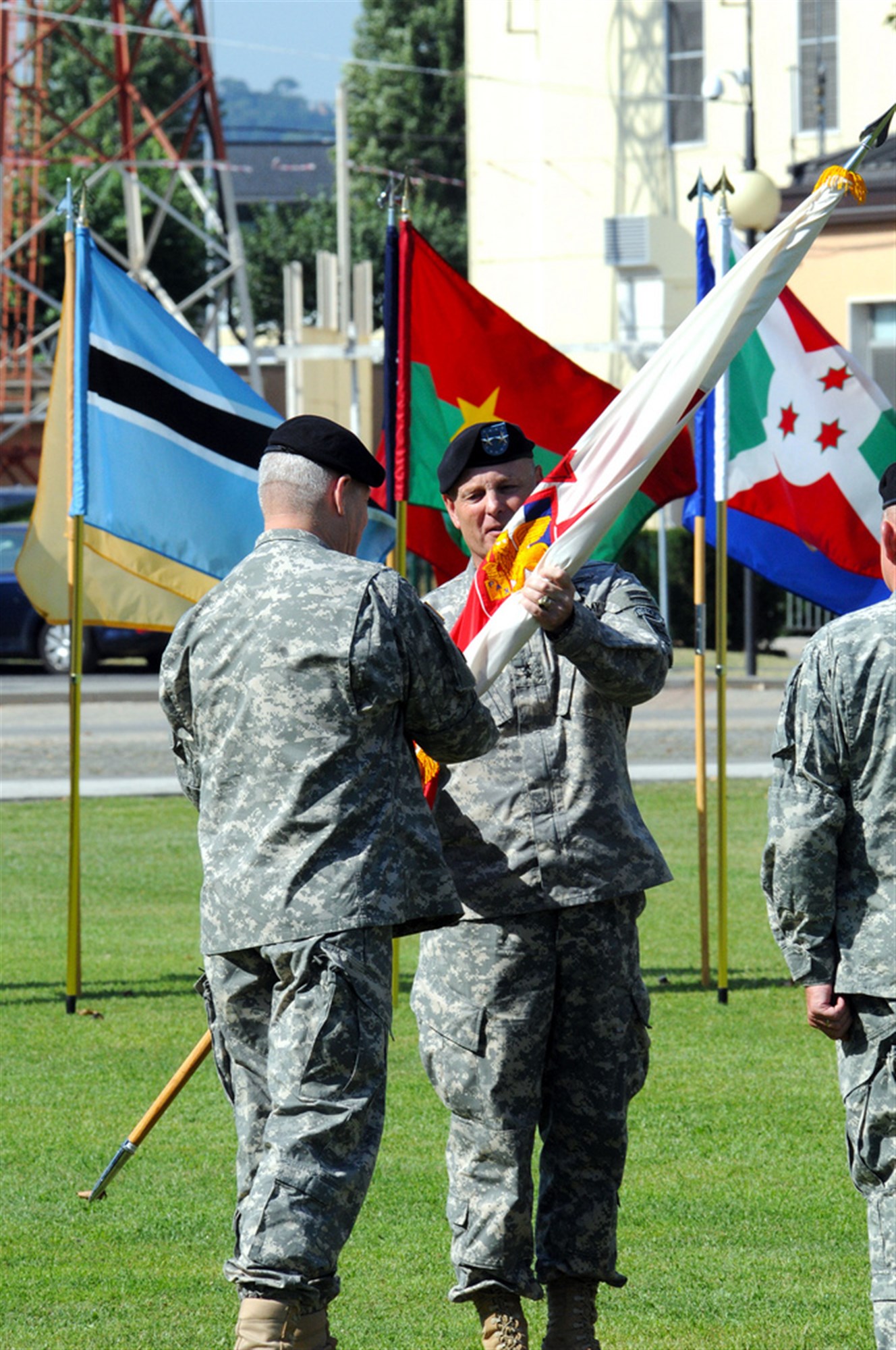 VICENZA, Italy - Major General Patrick J. Donahue accepts the U.S. Army Africa colors from General F Carter Ham, commander of U.S. Africa Command during a change of command ceremony, August 3, 2012. Accepting the flag is symbolic of Donahue becoming commander of U.S. Army Africa. (U.S. Army Africa photo by Rich Bartell)