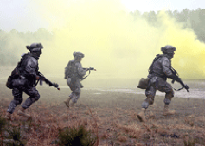 Navy Reservists and active duty personnel in an urban warfare training scenario. U.S. Navy photo.