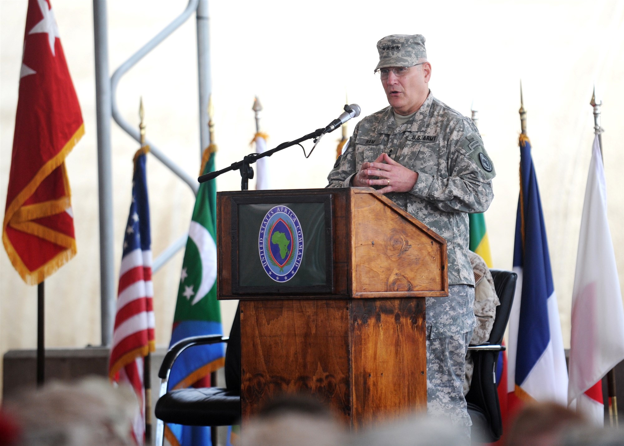 LEMONNIER, Djibouti - U.S. Army General Carter F. Ham, U.S. Africa Command commander, speaks at the Combined Joint Task Force-Horn of Africa change of command ceremony, May 19, 2011. As the event's presiding officer, Ham transfered command of authority from U.S. Navy Rear Admiral Brian L. Losey to U.S. Navy Rear Admiral Michael T. Franken. (U.S. Air Force photo by Master Sergeant Dawn M. Price)