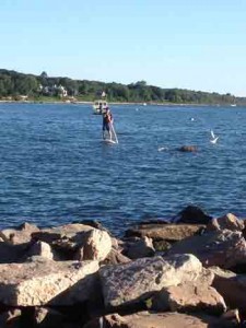 Paddle-boarding to work.