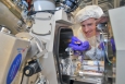 Kim Kisslinger, a researcher at Brookhaven Lab's Center for Functional Nanomaterials seen here with a focused-ion beam instrument, reduced the indium gallium nitride (InGaN) samples to a thickness of just 20 nanometers to prepare them for electron microscopy. | Photo courtesy of Brookhaven National Laboratory. 