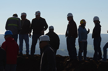 A tour of a coal mine site provides a unique perspective for OSMRE employees who stand on the edge of the coal mine and look down.