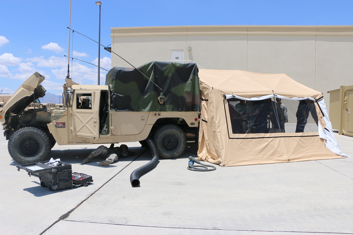 The ultralight, expeditionary command post tent can be erected in just a few seconds, shown here behind a vehicle at Aberdeen Proving Ground, Md.  Photo courtesy of CERDEC 