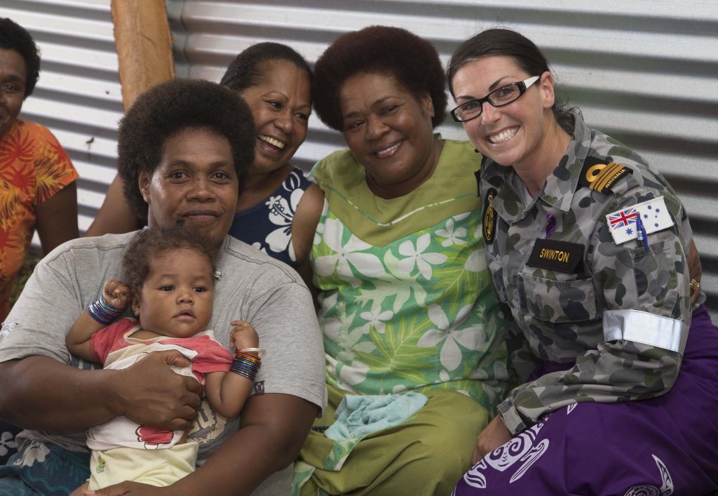 Royal Australian Navy officer Lieutenant Commander Jacqueline Swinton meets women from Vuna Village on Taveuni Island, Fiji. The visit to Vuna was part of International Women’s Day 2016 activities.