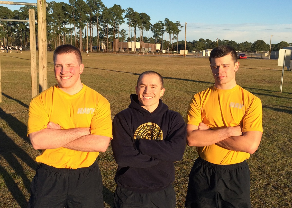 PENSACOLA, Fla. (Jan. 28, 2016) Cryptologic Technician (Networks) Seaman Apprentice Marc Johnson, left, and  Information Systems Technician Seaman Apprentice John Parsons, right, bested Lt.j.g. Dustin McKinney, center, during  a friendly local athletic competition at the Center for Information Dominance (CID) Unit Corry Station.  Parson and Johnson were the only team to beat McKinney, a TV show "American Ninja Warrior" participant and current student at CID Unit Corry Station. U.S. Navy photo by Lt. Emily Taynor 