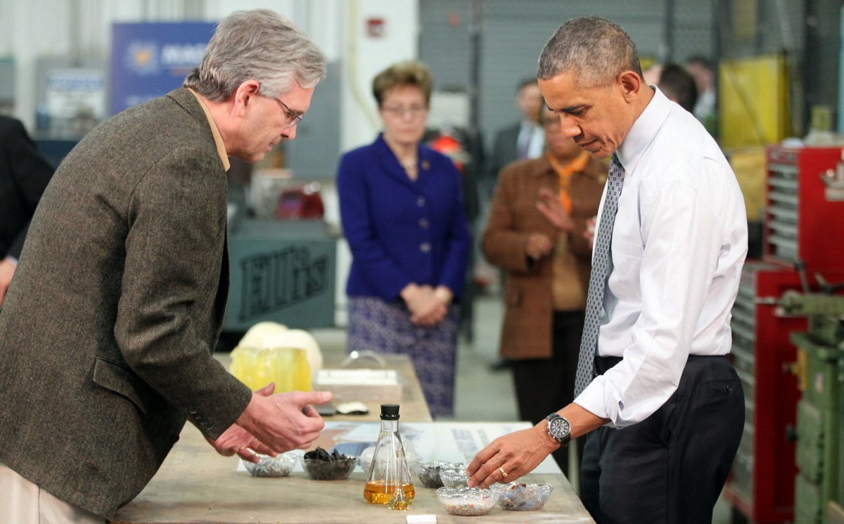 President Barack Obama learns about technology that recycles plastic into light crude oil from Vadxx Energy president Jim Garrett during a March 18, 2015 visit. NASA’s Glenn Research Center assisted in th4e development of the process through the Adopt a City program, part of the White House's Strong Cities, Strong Communities Initiative. Credits: Vadxx Energy
