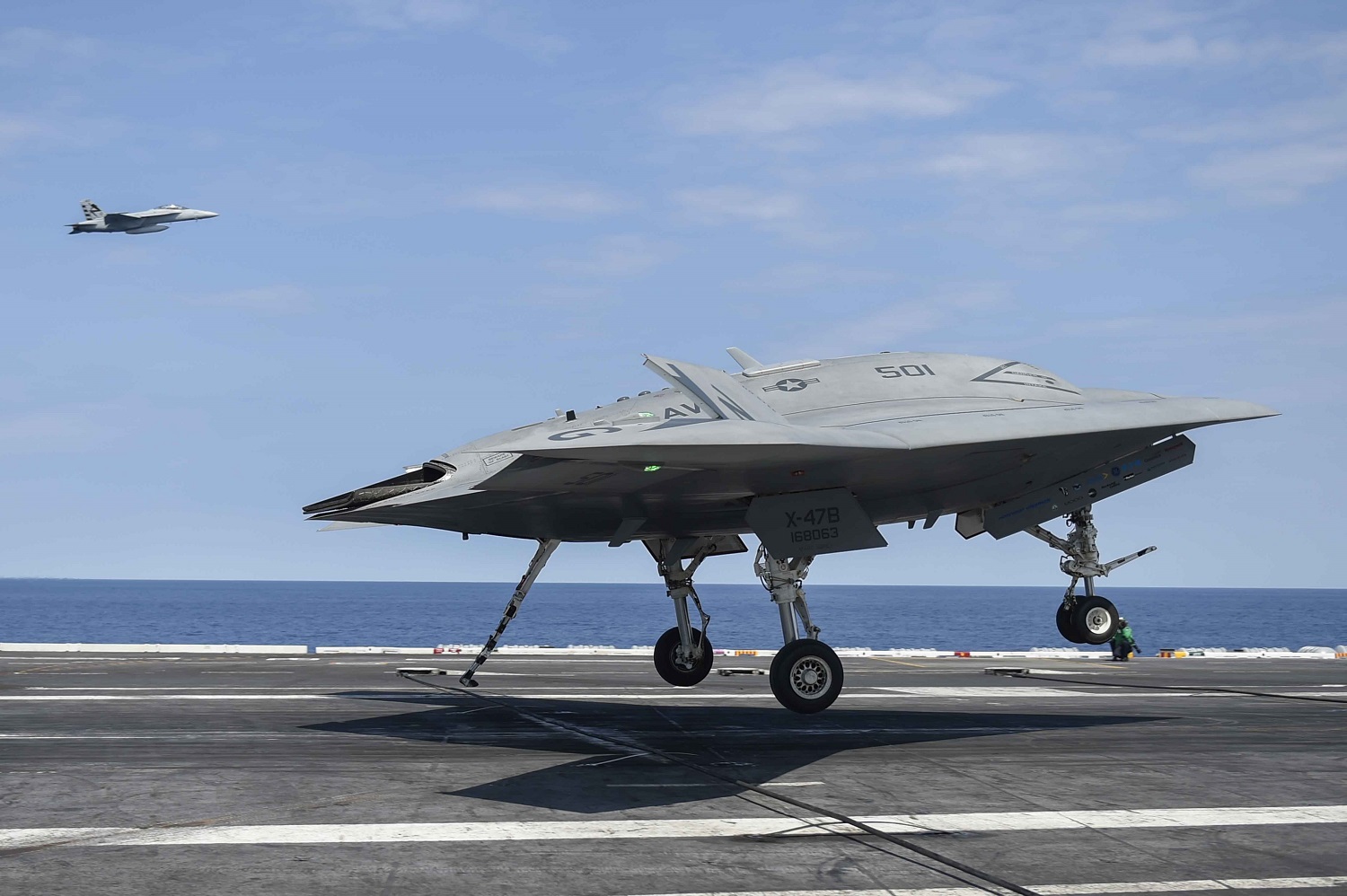 ATLANTIC OCEAN (Aug. 17, 2014) The Navy's unmanned X-47B lands aboard the aircraft carrier USS Theodore Roosevelt (CVN 71). The aircraft completed a series of tests demonstrating its ability to operate safely and seamlessly with manned aircraft. U.S. Navy photo 