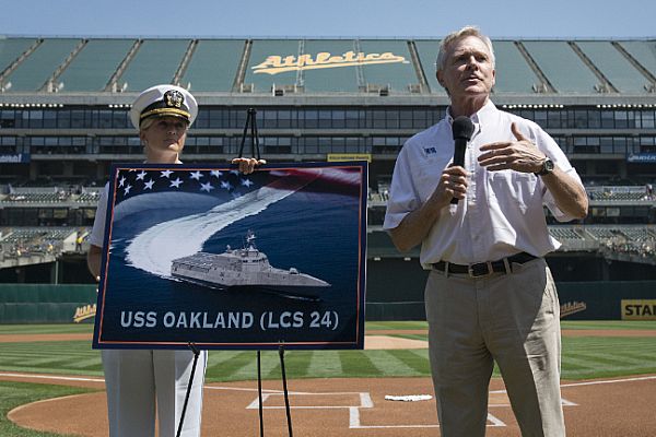 OAKLAND, Calif. (August 19, 2015) Secretary of the Navy (SECNAV) Ray Mabus announces the name of the Independence-class littoral combat ship LCS 24 as USS Oakland during a major league baseball game between the Oakland Athletics and Los Angeles Dodgers. U.S. Navy photo by Mass Communication Specialist 2nd Class Armando Gonzales.
