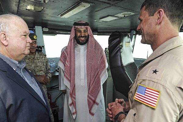 ARABIAN GULF (July 07, 2015) Prince Mohammed bin Salman bin Abdulaziz Al Saud, Second Deputy Premier, Deputy Crown Prince, Minister of Defense Kingdom of Saudi Arabia, speaks with Rear Adm. Andrew Lewis, commander of Carrier Strike Group (CSG) 12, aboard the aircraft carrier USS Theodore Roosevelt (CVN 71). Theodore Roosevelt is deployed in the U.S. 5th Fleet area of operations supporting Operation Inherent Resolve, strike operations in Iraq and Syria as directed, maritime security operations and theater security cooperation efforts in the region. U.S. Navy photo by Mass Communication Specialist 3rd Class Anna Van Nuys.