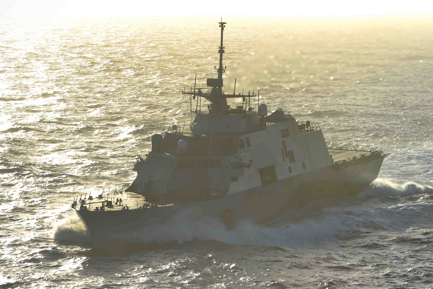 PACIFIC OCEAN (April 27, 2015) The littoral combat ship USS Freedom (LCS 1) transits alongside the aircraft carrier USS John C. Stennis (CVN 74). U.S. Navy ships are underway conducting an independent deployer certification exercise in the Southern California operating area. The exercise provides a multi-ship environment to train and certify independent deployers in surface warfare, air defense, maritime interception operations, command and control/information warfare, command, control, computers and combat systems intelligence and mine warfare. U.S. Navy photo by Mass Communication Specialist Seaman Christopher Frost.