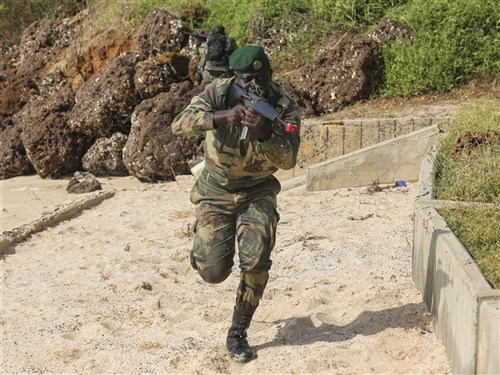 A Compagnie Fusilier de Marin Commando raids the beach during the final exercise with U.S. service members in Dakar, Senegal, Sept. 17, 2015. The Marines and Coast Guardsmen with Special-Purpose Marine Air-Ground Task Force Crisis Response-Africa spent four weeks training the COFUMACO on basic infantry tactics and small-boat operations as a part of a Maritime Security Force Assistance mission to increase interoperability with Senegal’s and strengthen the bond between the partner nations.  (U.S. Marine Corps photo by Cpl. Olivia McDonald/Released)