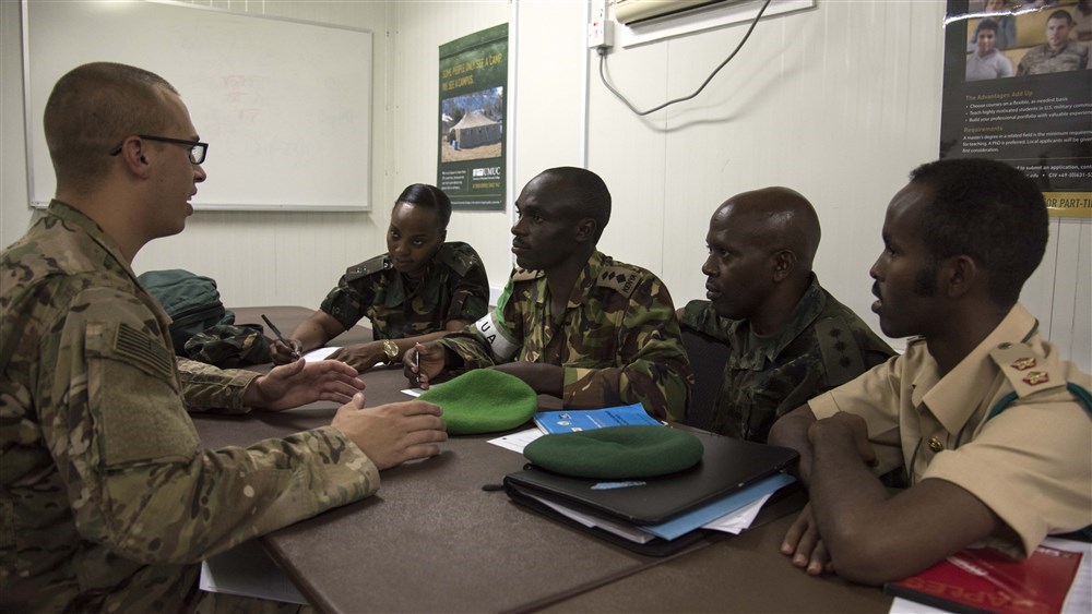 Multinational members from partner nations practice conversing with simulated local media during the Public Information Officer Conference, hosted by Combined Joint Task Force-Horn of Africa, at Camp Lemonnier, Djibouti, Nov. 4, 2015. 