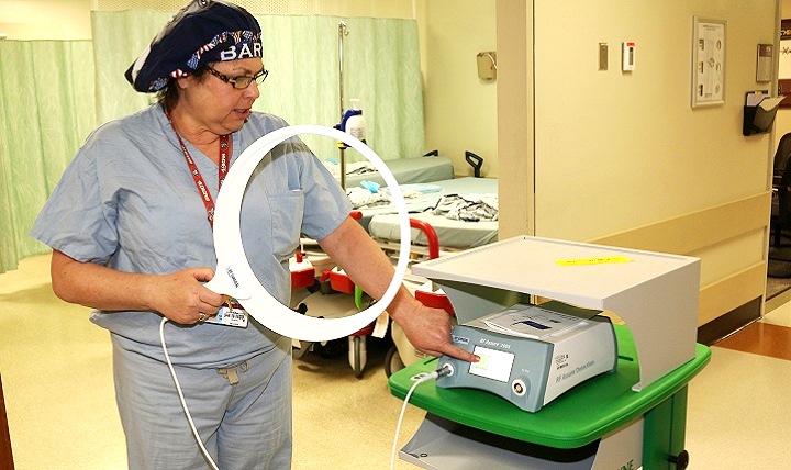 Evans Army Community Hospital operating room nurse Regina Andrews performs a diagnostic test on the RFID wand. The wand is used to locate surgical sponges embedded with an RFID chip. (U.S. Army photo by Jeff Troth)