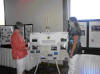 Oklahoma Tribal Resource Conservationist Melanie Oliver, discusses Osage grazing with conference attendee.