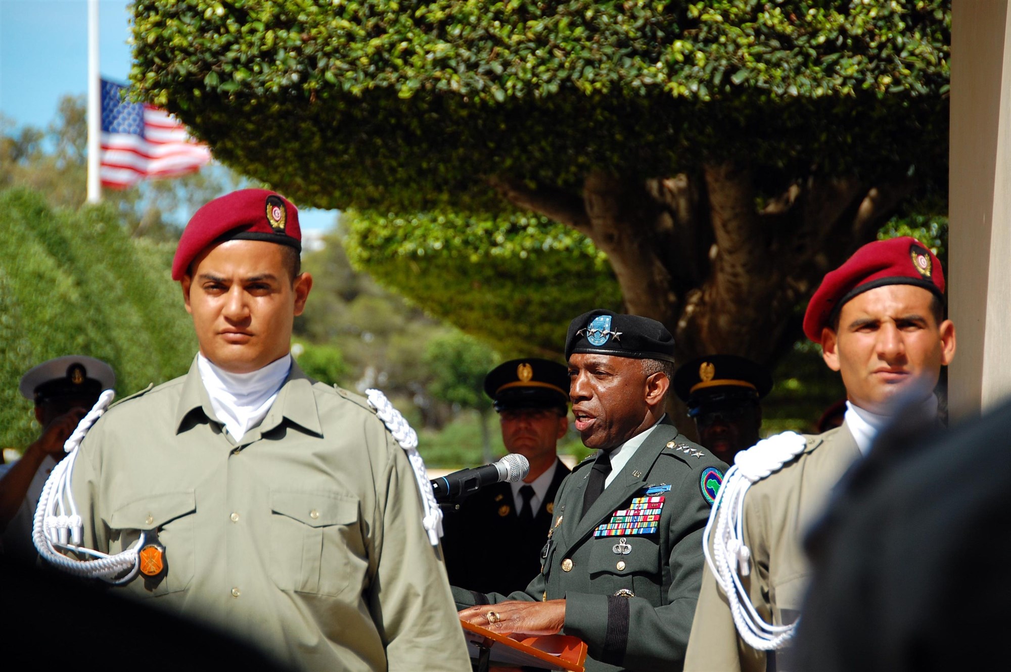 CARTHAGE, Tunisia - Flanked by members of a Tunisian honor guard, U.S. General William Ward delivers a Memorial Day speech May 31, 2010, at the North Africa American Cemetery and Memorial in the ancient city of Carthage. The cemetery and memorial honors thousands of American military men and women who gave their lives in and around North Africa during World War II.  (Photo by Vince Crawley, U.S. Africa Command)