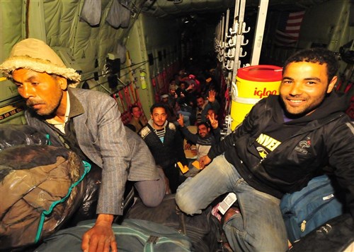 DJERBA, Tunisia -- Egyptian nationals who have fled to Tunisia from violence and instability in Libya are transported aboard a U.S. Air Force C-130J from Djerba, Tunisia to Cairo, Egypt, on March 5, 2011. This response to the developing humanitarian crisis is part of a broader U.S. government effort to relieve suffering caused by the crisis the in Libya. (Air Force photo by Staff Sergeant Brendan Stephens)