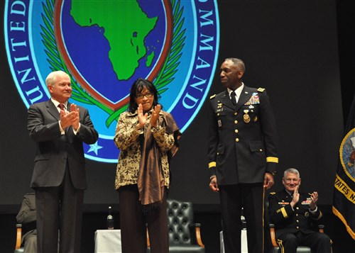 SINDELFINGEN, Germany - Secretary of Defense Robert M. Gates and Joyce Ward congratulate General William E. Ward, commander, U.S. Africa Command, during a change-of-command ceremony where Ward relinquished command to General Carter F. Ham March 9, 2011, at the Stadthalle in Sindelfingen, Germany. Gates presented Ward with the Defense Distinguished Service Award for his leadership and accomplishments as U.S. AFRICOM commander.  (AFRICOM photo by Petty Officer 1st Class Daniel Lapierre)