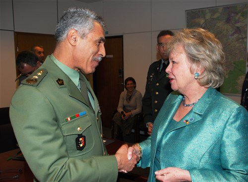 BRUSSELS, Belgium - Colonel Miloud Lakhdari, Algerian defense attache to Belgium (left), greets Ambassador Mary Carlin Yates, U.S. Africa Command&#39;s deputy to the commander for civil-military activities, during Yates&#39; official visit to Brussels March 12-13, 2009. Leading a small Africa Command delegation from its headquarters in Stuttgart, Germany, Yates met with Belgian Ministry of Defense and Ministry of Foreign Affairs officials to share information about U.S. Africa Command activities and to discuss possibilities for future cooperation in Africa, such as maritime security and capacity-building. Yates also met with other U.S. government officials based in Brussels. (U.S. Africa Command photo by Kenneth Fidler)