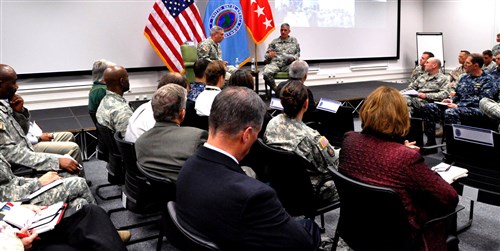 General David M. Rodriguez, U.S. Africa Command commander, and Command Sergeant Major Darrin Bohn, AFRICOM Command Senior Enlisted Leader, conduct an all-hands meeting, at U.S. Army Garrison Stuttgart, Germany, July 31, 2014.  AFRICOM staff had an opportunity to have questions answered by the commander and hear first-hand from leadership on ways to improve quality of life and workplace issues.  (AFRICOM photos by Air Force Technical Sergeant Olufemi Owolabi/Released)