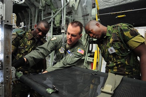 THEBEPHATSHWA AIR BASE, Botswana - U.S. Air Force Master Sergeant Chris Choate, center, shows members of the Botswanan military how to properly secure a litter on a C-130 Hercules aircraft as part of an aeromedical evacuation exercise, August 11, 2012. (U.S. Air Force photo by Senior Airman Lausanne Morgan)