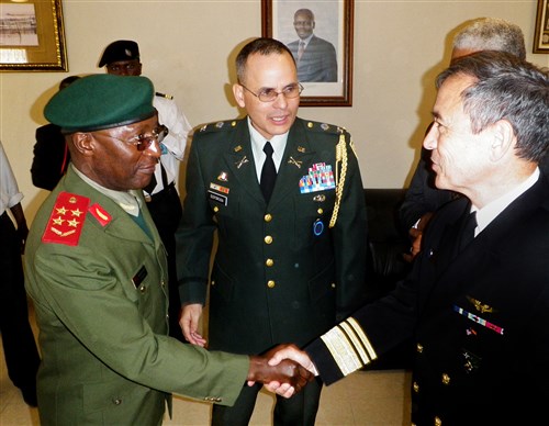 LUANDA, Angola - Angolan Army General Geraldo Nunda, chief of defense (left), greets Vice Admiral Harry B. Harris Jr., commander of U.S. 6th Fleet (right), and U. S. Army Colonel Jose Esposito, U. S. Defense Attache to Angola, at a reception commemorating the 35th anniversary of the establishment of the Angolan navy, July 10, 2011. Nunda said the Angolan navy seeks to strengthen ties and increase opportunities with the U.S. Navy. (U.S. Navy photo)