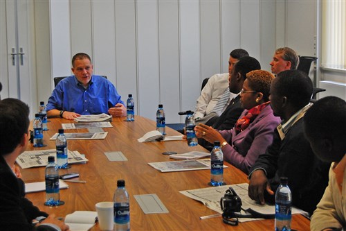 KAISERSLAUTERN, Germany - Howard Witt, senior managing editor of Stars and Stripes and former Chicago Tribune journalist, discusses press freedom issues with Cameroonian media September 17, 2009, at the daily newspaper's European offices.  The group from Cameroon included four journalists, a university dean and two U.S. Embassy staff. During a U.S. Embassy funded visit to Germany, they were hosted by Africa Command for interviews and briefings about the work of the U.S. military Africa. Stars and Stripes is a daily newspaper funded by the U.S. government but chartered by U.S. Congress to provide independent, uncensored news for U.S. military personnel overseas. (Photo by Lieutenant Colonel Lane Benefield, Stars and Stripes Europe)