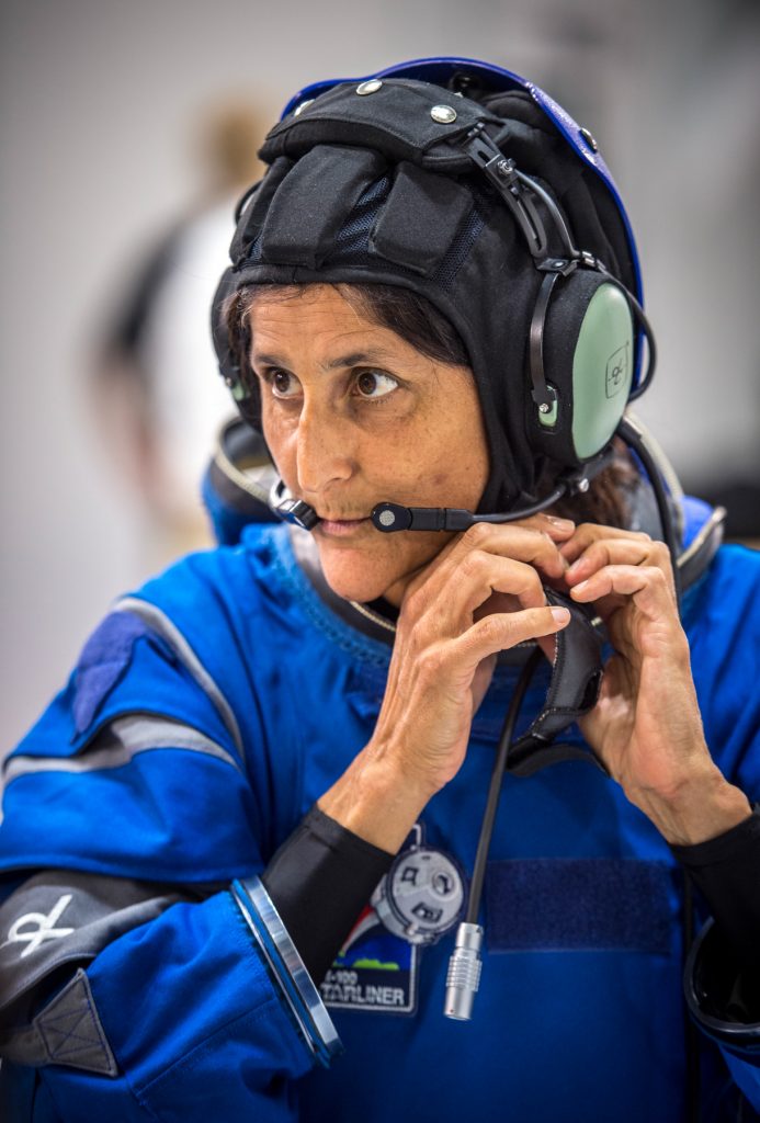 Female astronaut in blue spacesuit (Boeing)