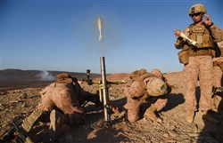 U.S. Marine Corps mortarmen, Weapons Platoon, Battalion Landing Team 1st Battalion, 4th Marines, 11th Marine Expeditionary Unit (MEU), fire a white phosphorous M722A1 round from a M224 60mm Lightweight Company Mortar System during exercise Alligator Dagger, Dec. 13, 2016, at Arta Plage, Djibouti. The M722A1 rounds, weighing just under four pounds, can be used for spotting or marking a target area with a smoke cloud. The exercise allows opportunities for the 11th MEU to maintain their respective skills and proficiencies. (U.S. Air National Guard photo by Staff Sgt. Penny Snoozy)