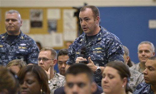 U.S. Navy Lt. Cmdr Andy Young asks a question during a troop event hosted by U.S. Defense Secretary Ash Carter at U.S. Africa Command headquarters in Stuttgart, Germany, June 4, 2015. DoD photo by Glenn Fawcett  